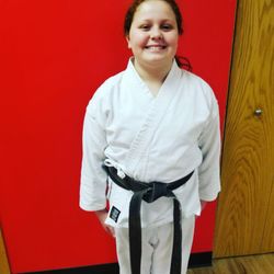 HIVE Martial Arts - Feeling like a Rock Star! Ms. Maddison earned "Black Belt for a Day" though hard work and focus.