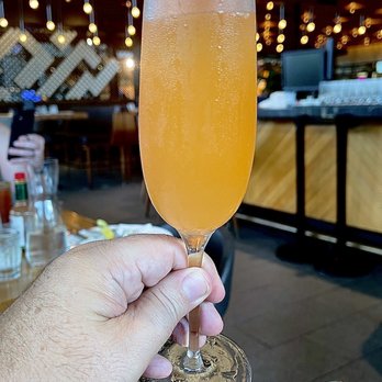Earls Kitchen + Bar - Watermelon Mimosa - New American Near Me - Miami, Florida Earls Kitchen + Bar - Watermelon Mimosa - New American Near Me - Miami, Florida