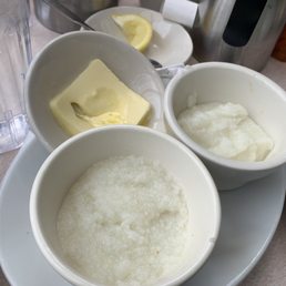 Grits! Small cups- nice to have real butter on side though.