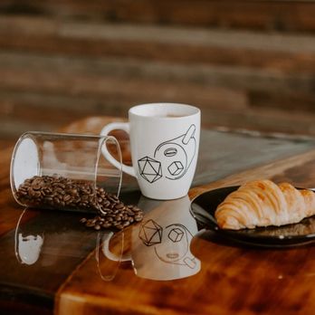 Chaotic Good - a croissant on a table - Coffee & Tea Near Me - Lexington, Kentucky Chaotic Good - a croissant on a table - Coffee & Tea Near Me - Lexington, Kentucky