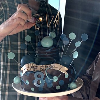 Masse's Pastries - Custom Chocolate cake with edible blue "white chocolate" decorations - Bakeries Near Me - Berkeley, California