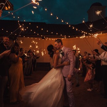 La Buena Vida Vineyards - a bride and groom kissing while surrounded by sparklers - Wineries Near Me - Springtown, Texas