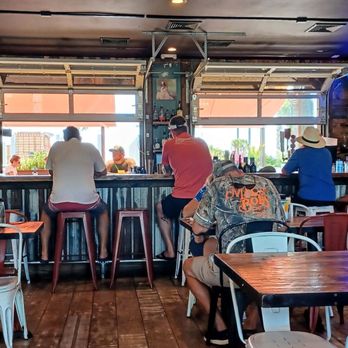 Pizza Hyena - U side bar area which loops around outside with outside seating. - Pizza Near Me - Surfside Beach, South Carolina Pizza Hyena - U side bar area which loops around outside with outside seating. - Pizza Near Me - Surfside Beach, South Carolina