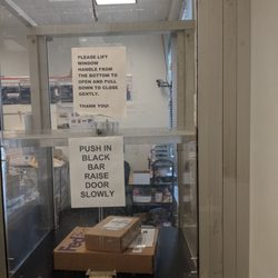 US Post Office - Please place your package behind this bullet proof glass, thanks