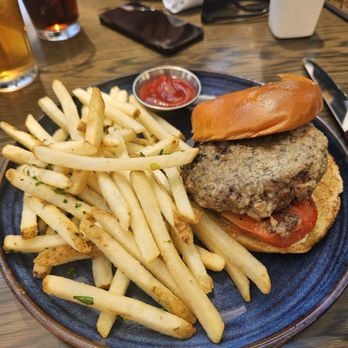 Eureka! - 28 day aged bone marrow burger.  Big piece of onion thrown on the grill for the "grilled" onions - American Near Me - Clovis, California