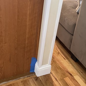 MGR Properties - a dog sitting on the floor in front of a door - Refinishing Services Near Me MGR Properties - a dog sitting on the floor in front of a door - Refinishing Services Near Me