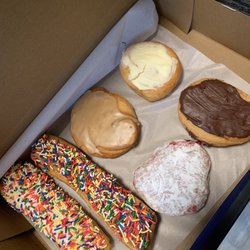 Jack’s Donuts of Crawfordsville - Two sprinkle donuts (one vanilla, one chocolate), maple donut, raspberry filled donut, blueberry cheesecake donut, and Boston cream donut