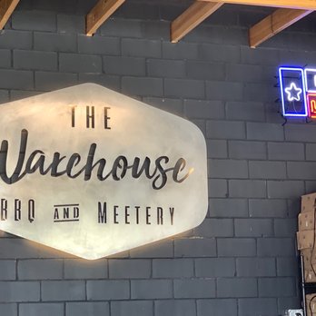 The Warehouse BBQ and Meetery - a neon sign - Barbeque Near Me - Burnet, Texas The Warehouse BBQ and Meetery - a neon sign - Barbeque Near Me - Burnet, Texas