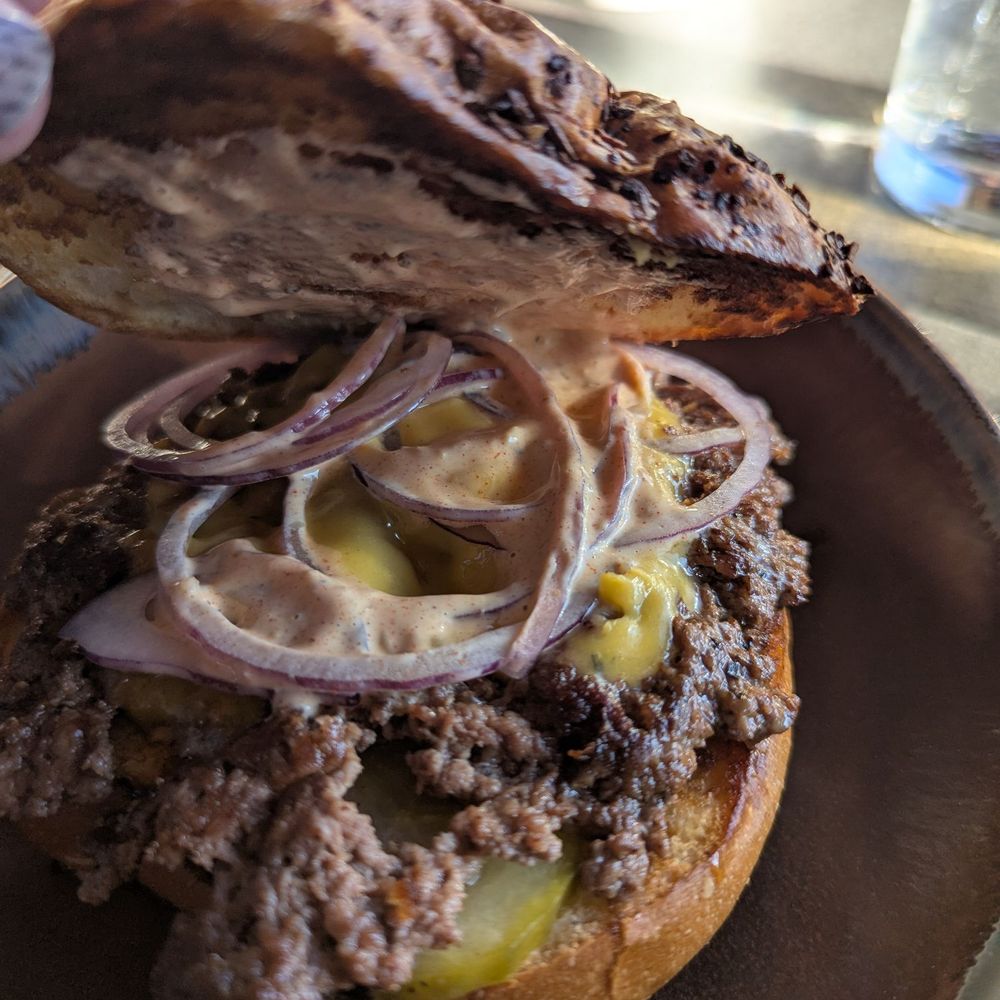 Aftermath Kitchen & Bar - Aftermath Burger (Happy Hour single patty) - New American Near Me - Phoenix, Arizona Aftermath Kitchen & Bar - Aftermath Burger (Happy Hour single patty) - New American Near Me - Phoenix, Arizona