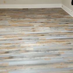 Tom's Weintrauts Carpet Warehouse - New floors with Dash my puppy checking them out.