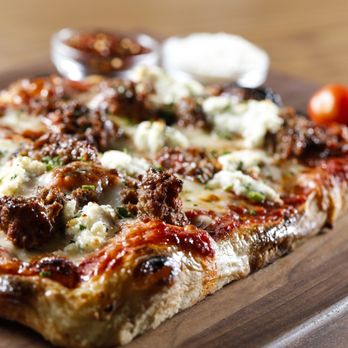 P Za Kitchen - a square pizza on a cutting board - Food Delivery Services Near Me P Za Kitchen - a square pizza on a cutting board - Food Delivery Services Near Me