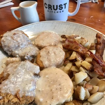 Crust Kitchen - Fried chicken and garlic biscuits with gravy and potatoes. They put bacon on the potatoes as a surprise. Plan to take some home. - Pizza Near Me - San Diego, California