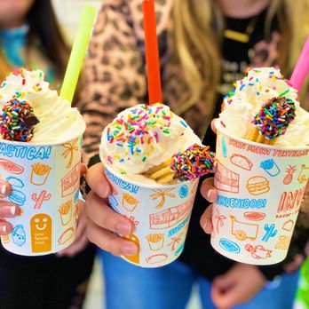 Invicto - two girls holding two cups of ice cream and sprinkles - Tacos Near Me - Vernon Hills, Illinois Invicto - two girls holding two cups of ice cream and sprinkles - Tacos Near Me - Vernon Hills, Illinois