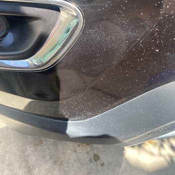 Kenyon Auto Cosmetics - Overspray still in the car and the white spot on the trim that they created with their products - Auto Detailing Near Me - Phoenix, Arizona