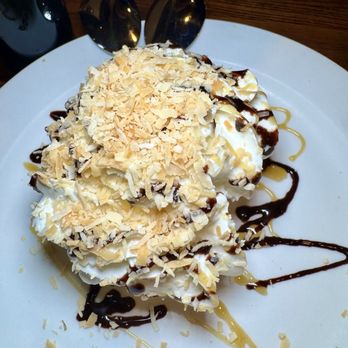 Cahill Bistro - The BEST Tres Leches! The mix of the caramel and toasted coconuts married with this moist, luxuriously soft cake is heavenly! - Latin American Near Me - Edina, Minnesota