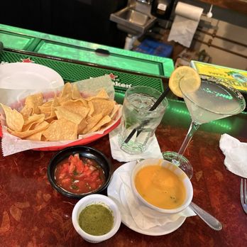 Sazon Latina - Chips, salsa, queso, habanero (verde) salsa (with Lemondrop martini and Tito's and tonic) - Latin American Near Me - Gainesville, Virginia Sazon Latina - Chips, salsa, queso, habanero (verde) salsa (with Lemondrop martini and Tito's and tonic) - Latin American Near Me - Gainesville, Virginia
