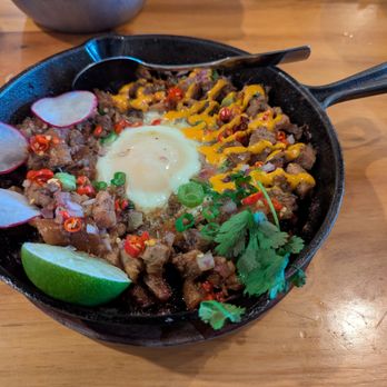 Kamayan Atl - Sizzling Sisig. $21. Slow-roasted pork belly, chopped cheek and snout with pate served on a sizzling plate. Mild spice. - Filipino Near Me - Doraville, Georgia Kamayan Atl - Sizzling Sisig. $21. Slow-roasted pork belly, chopped cheek and snout with pate served on a sizzling plate. Mild spice. - Filipino Near Me - Doraville, Georgia