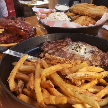 Kloby's Smokehouse - Steak Frites! 12oz ribeye w/garlic butter & their handcut fries. left back "Dirt & Old" Pork Ribs. Back right Southern Fried Catfish Platter - Barbeque Near Me - Laurel, Maryland Kloby's Smokehouse - Steak Frites! 12oz ribeye w/garlic butter & their handcut fries. left back "Dirt & Old" Pork Ribs. Back right Southern Fried Catfish Platter - Barbeque Near Me - Laurel, Maryland