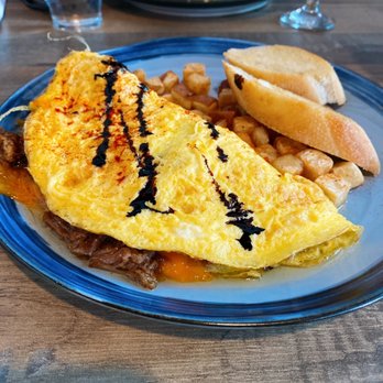 Kaffe Haus - Boricua omelette, served with breakfast potatoes and toast. - Breakfast & Brunch Near Me - San Juan, Puerto Rico Kaffe Haus - Boricua omelette, served with breakfast potatoes and toast. - Breakfast & Brunch Near Me - San Juan, Puerto Rico