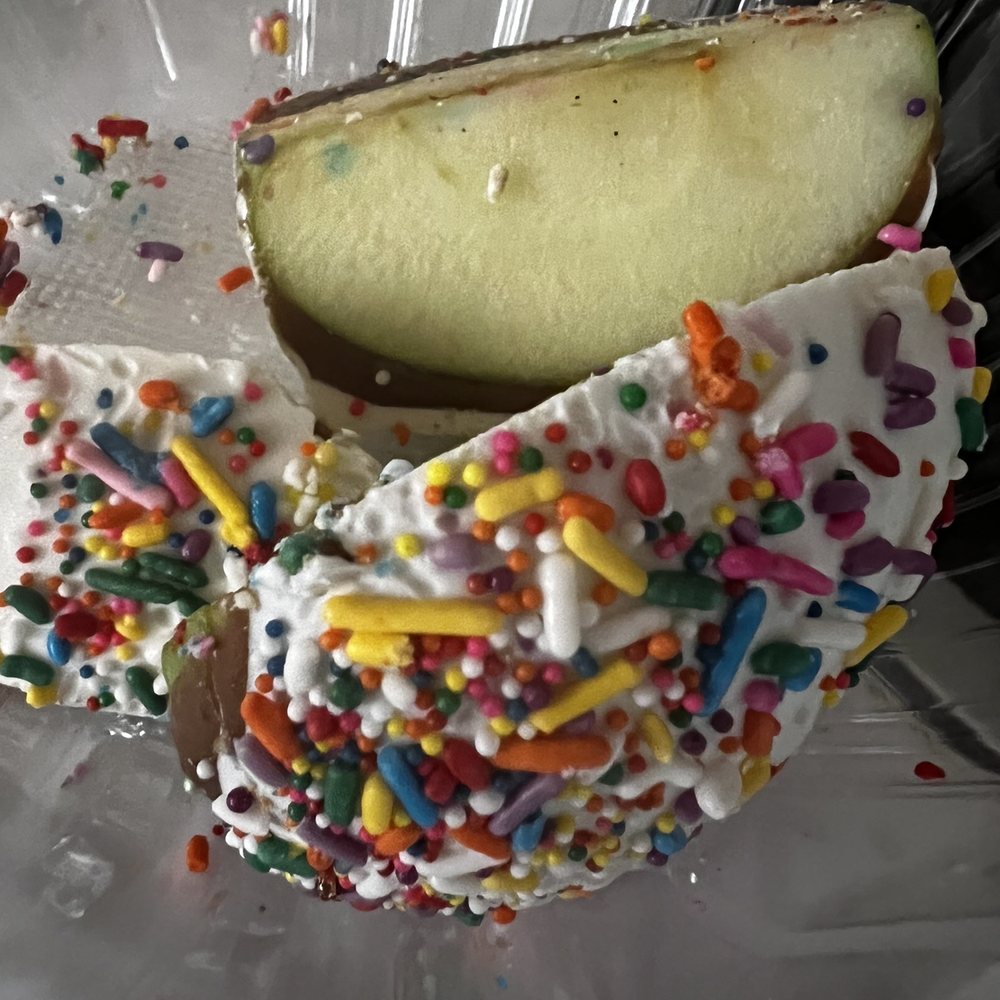 Famous Apples - White chocolate caramel and sprinkles - Desserts Near Me - Northridge, California Famous Apples - White chocolate caramel and sprinkles - Desserts Near Me - Northridge, California