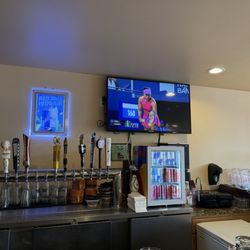 The bar area and sign indicating when the beer lines were last changed.
