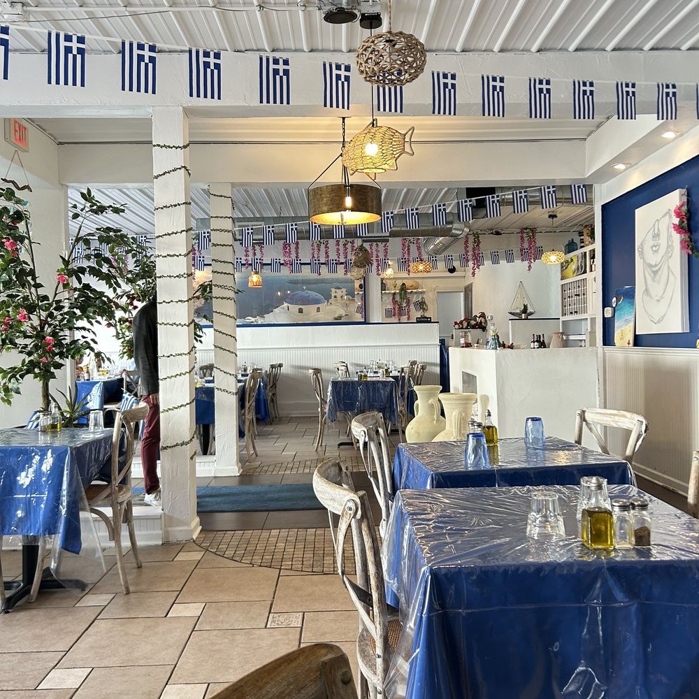 Petos - the inside of a restaurant with tables and chairs - Greek Near Me - Carmel, Indiana Petos - the inside of a restaurant with tables and chairs - Greek Near Me - Carmel, Indiana