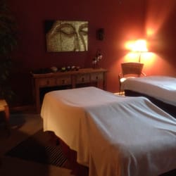 On the River Massage & Healing Arts - Couple's room with natural light and a door opening out onto the Riverwalk and Big Thompson River