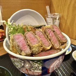 A5 Wagyu steak tempura bowl-- with fried onions + egg, kabocha, nori, shiso tempura.  Limited number of bowls daily