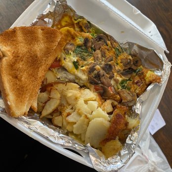 Adam's Place - Veggie omelet with extra mushrooms, cheese and spinach. Half hash browns, half grits and cheese (grits not pictured). - American Near Me - Cleveland, Ohio