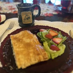 1900 Inn on Montford - The second course of breakfast. Savory ham and smoked Gouda pastry with mixed green salad.