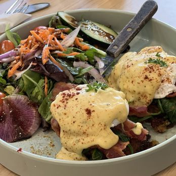 Gina's Kitchen +Catering - Eggs Benedict on leak cake and bacon; With a side salad. - Breakfast & Brunch Near Me - Rancho Cucamonga, California Gina's Kitchen +Catering - Eggs Benedict on leak cake and bacon; With a side salad. - Breakfast & Brunch Near Me - Rancho Cucamonga, California