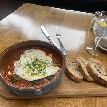 Robins Restaurant - Shakshuka* delicious, yummy bread on the side - New American Near Me - Cambria, California Robins Restaurant - Shakshuka* delicious, yummy bread on the side - New American Near Me - Cambria, California