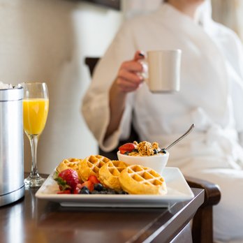 Deadwood Mountain Grand - a woman in a bathrobe and waffles - New American Near Me - Deadwood, South Dakota Deadwood Mountain Grand - a woman in a bathrobe and waffles - New American Near Me - Deadwood, South Dakota