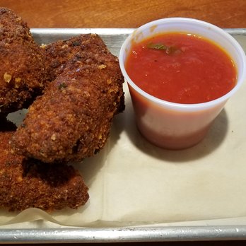 Fritz's Restaurant - Risotto fritter appetizer with tomato basil dipping sauce. - American Near Me - New Brunswick, New Jersey Fritz's Restaurant - Risotto fritter appetizer with tomato basil dipping sauce. - American Near Me - New Brunswick, New Jersey