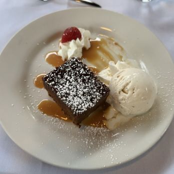 Copley's - Toffee and Date English Sticky Pudding served with Tahitian vanilla ice cream. - New American Near Me - Palm Springs, California Copley's - Toffee and Date English Sticky Pudding served with Tahitian vanilla ice cream. - New American Near Me - Palm Springs, California