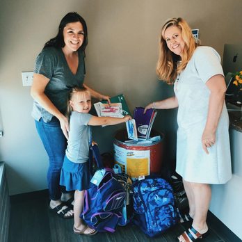 RE/MAX Town Center - Cindy Woodward, Realtor, making donations to the supplies drive with her family. - Real Estate Services Near Me - Mill Creek, Washington RE/MAX Town Center - Cindy Woodward, Realtor, making donations to the supplies drive with her family. - Real Estate Services Near Me - Mill Creek, Washington
