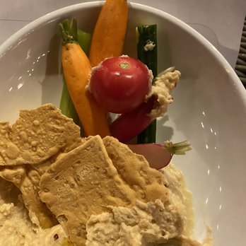 District - Yeaaa don't know about you but that tomato should of been cut but than again that's me - hummus platter - Cocktail Bars Near Me - Los Angeles, California