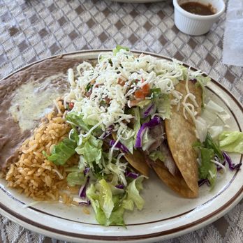Tacos Al Pastor - Carnitas hard shell tacos with lettuce, tomato, cheese and salsa with Mexican rice and refried beans. - Mexican Near Me - San Jose, California Tacos Al Pastor - Carnitas hard shell tacos with lettuce, tomato, cheese and salsa with Mexican rice and refried beans. - Mexican Near Me - San Jose, California