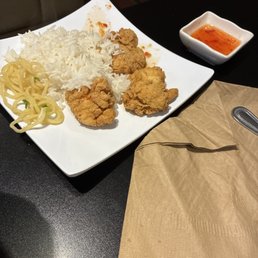 Split the kids chicken and side of rice between 2 kids. Added some ramen noodles from our meal too. Split the kids chicken and side of rice between 2 kids. Added some ramen noodles from our meal too.