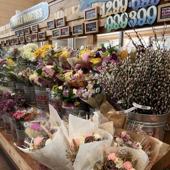 Trader Joe's - A variety of flower bouquets and arrangements are displayed in metal buckets and wrapped in paper at Trader Joe's in Brooklyn, NY. - Grocery Near Me - Brooklyn, New York