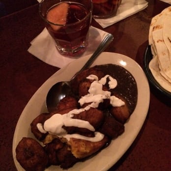Cha Cha Cha - Fried plantains with a sour cream drizzle and black beans + sangria - Cocktail Bars Near Me - San Francisco, California Cha Cha Cha - Fried plantains with a sour cream drizzle and black beans + sangria - Cocktail Bars Near Me - San Francisco, California