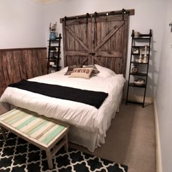 Mason Square Hotel - The Farmhouse room has my favorite wood accents, including these great barn doors.