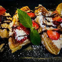 Vintage BYOB - Belgian waffle (gluten free) with cheesecake spread, berries, powdered sugar and chocolate drizzle.  Highly recommend!