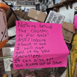 Salida Thrift - Warning sign to physically kick you out the door if you say the wrong thing