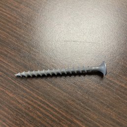 Metal screw found on the carpet floor