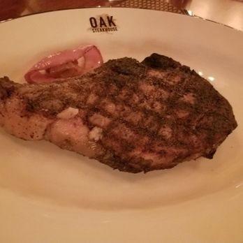 Oak Steakhouse - Aged bone in ribeye - Steakhouses Near Me - Raleigh, North Carolina