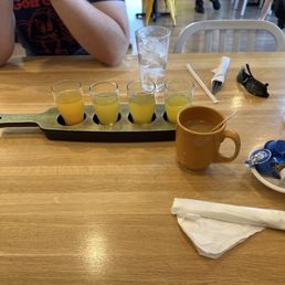 Mimosa flight (swapped cranberry for pineapple) and coffee Mimosa flight (swapped cranberry for pineapple) and coffee