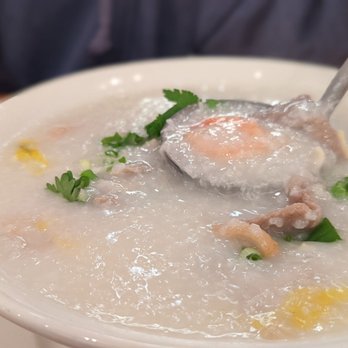 Congee Queen - a bowl of congee with a spoon in it - Cantonese Near Me - Toronto, Ontario Congee Queen - a bowl of congee with a spoon in it - Cantonese Near Me - Toronto, Ontario