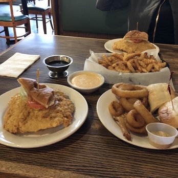 Railroad Cafe - Half of a tenderloin sandwich with side fries and roast beef sandwich with onion rings. - Cafes Near Me - Mitchell, Indiana