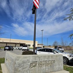 US Post Office - USPS sign with the American flag